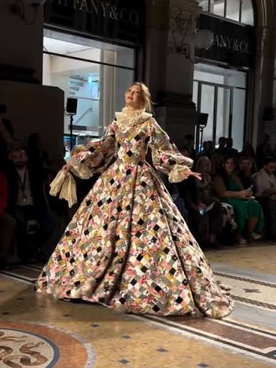 Supermodel Gigi Hadid opens Vogue World Milano 2026 at the Galleria Vittorio Emanuele II in a Renaissance-inspired patchwork gown designed by Alessandro Michele for Valentino